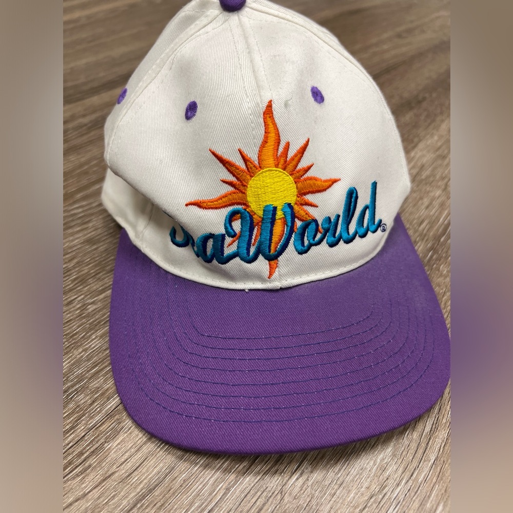 Vintage 90s Sea World ball cap hat.  Purple brim with sun on front.